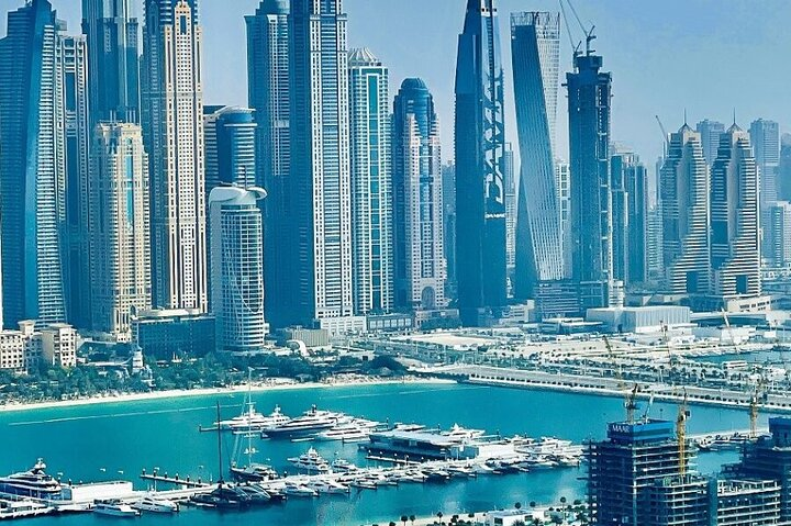 Explore the stunning skyline of Abu Dhabi where modern marvels meet serene waters offering an unforgettable experience of the city's unique blend of tradition and innovation.